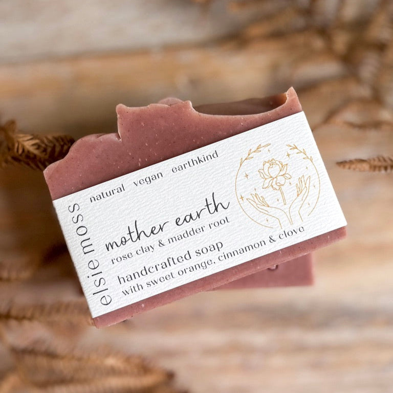 Handcrafted soap bar with a label on a natural background