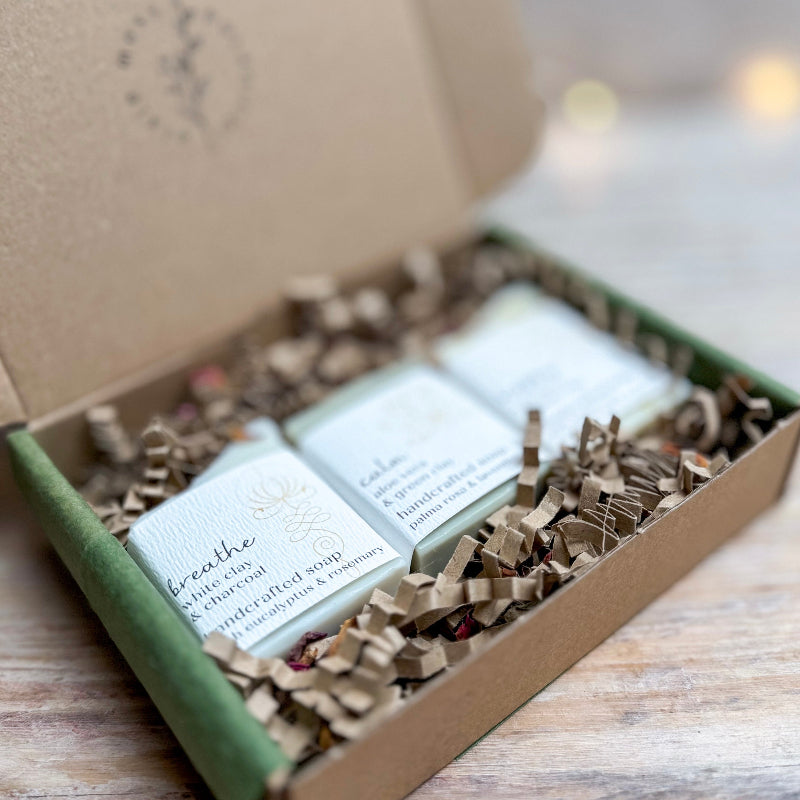Box of soap bars with visible text on a wooden surface