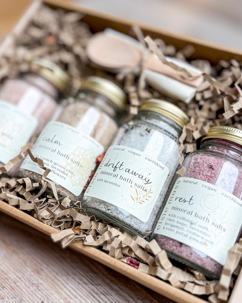 Jars of bath salts with labels in a decorative box