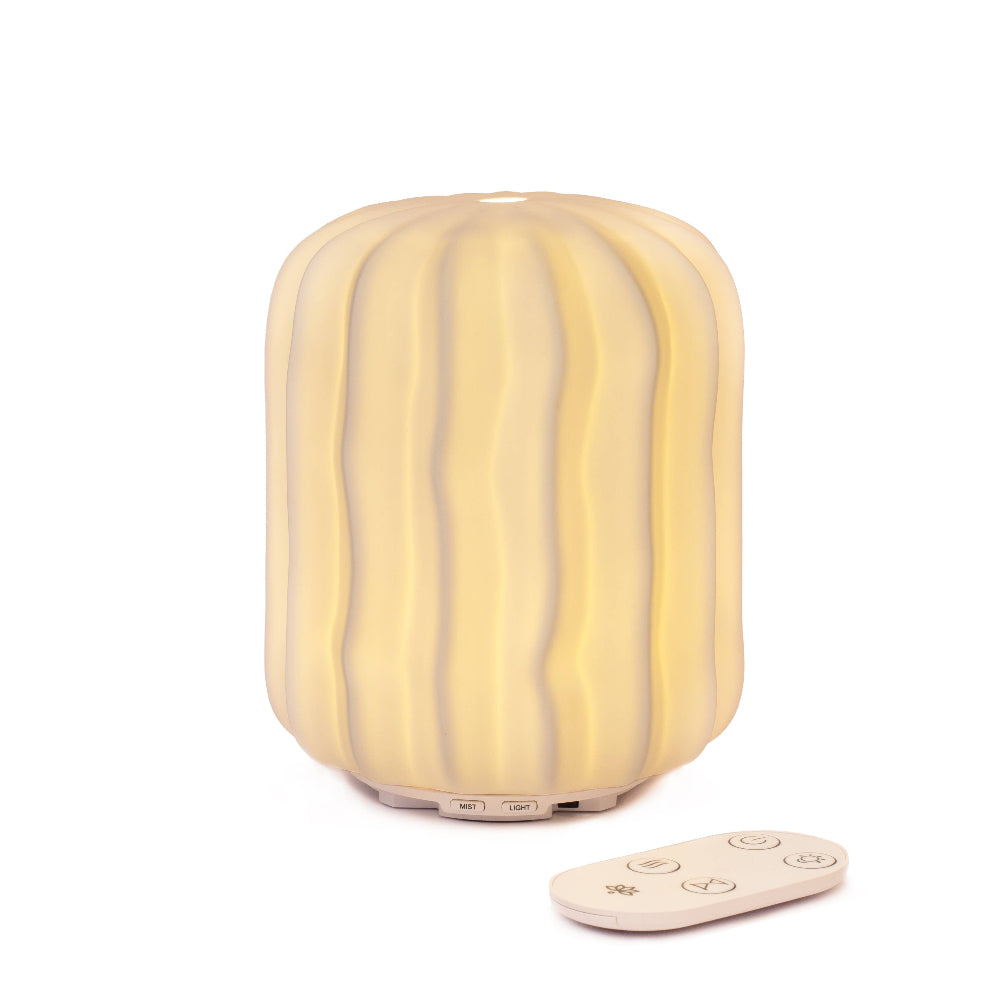 Yellow textured lamp with remote control on a white background