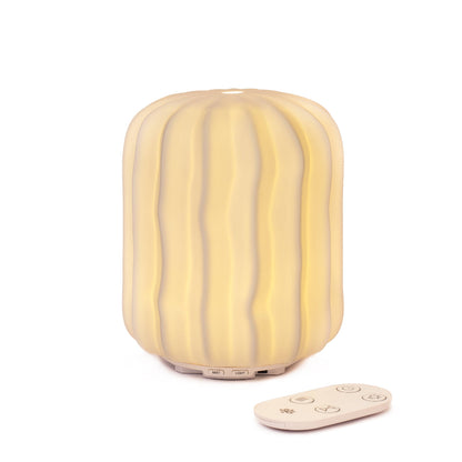 Yellow textured lamp with remote control on a white background
