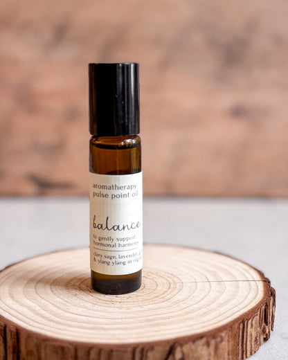 Roll-on bottle of aromatherapy pulse point oil labeled &