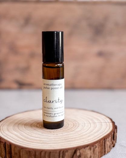 Roll-on bottle of aromatherapy pulse point oil labeled &