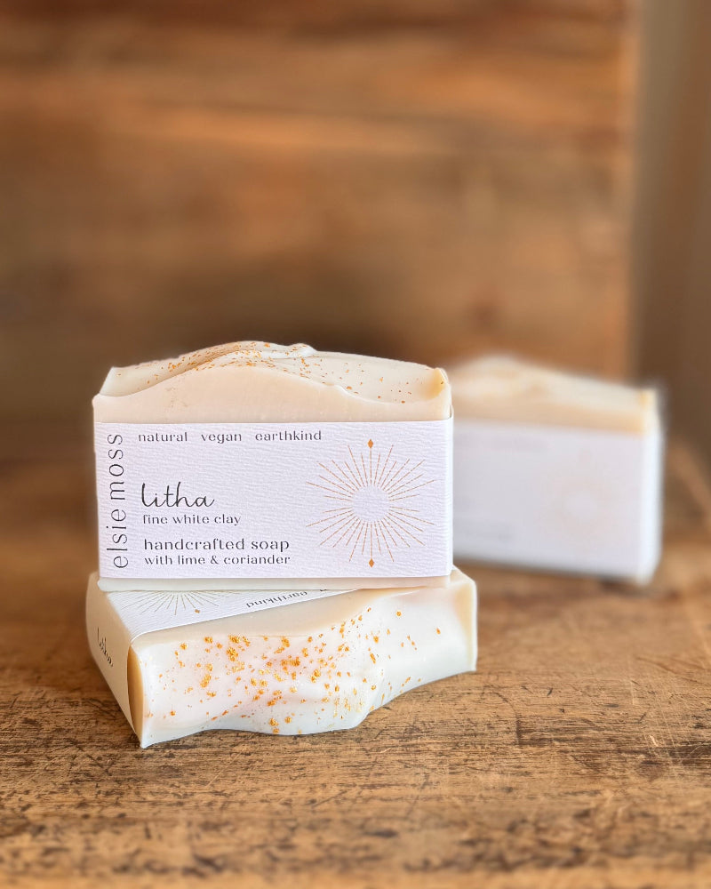 Bar of soap with a visible label on a wooden surface