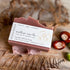 Handcrafted soap bar with a label on a natural background