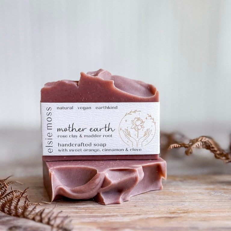 Bar of soap with a label on a wooden surface