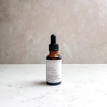 Nourishing Face Oil for Day Time in an amber bottle with pipette 
