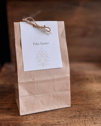 Kraft paper bag with a white label featuring &