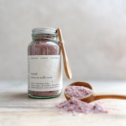 jar of Rest bath salts with wooden spoon