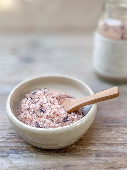 Restore Bath Salts in a dish with a wooden spoon