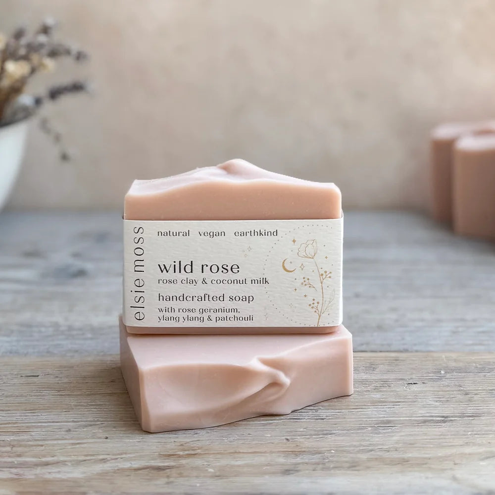 Natural, pale pink soap bar with a paper label