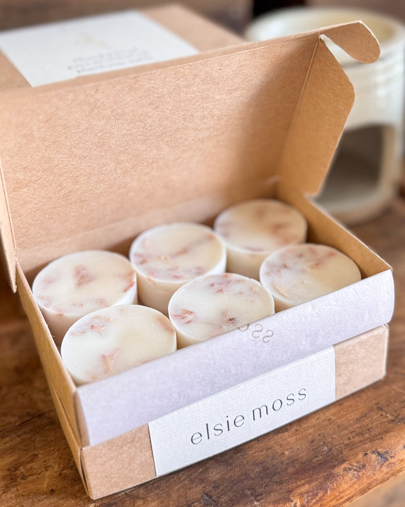 A kraft paper gift box with a white paper band labeled &