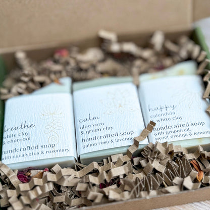 Three bars of soap in a box with visible labels