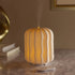 Decorative lamp with wavy pattern on a marble surface