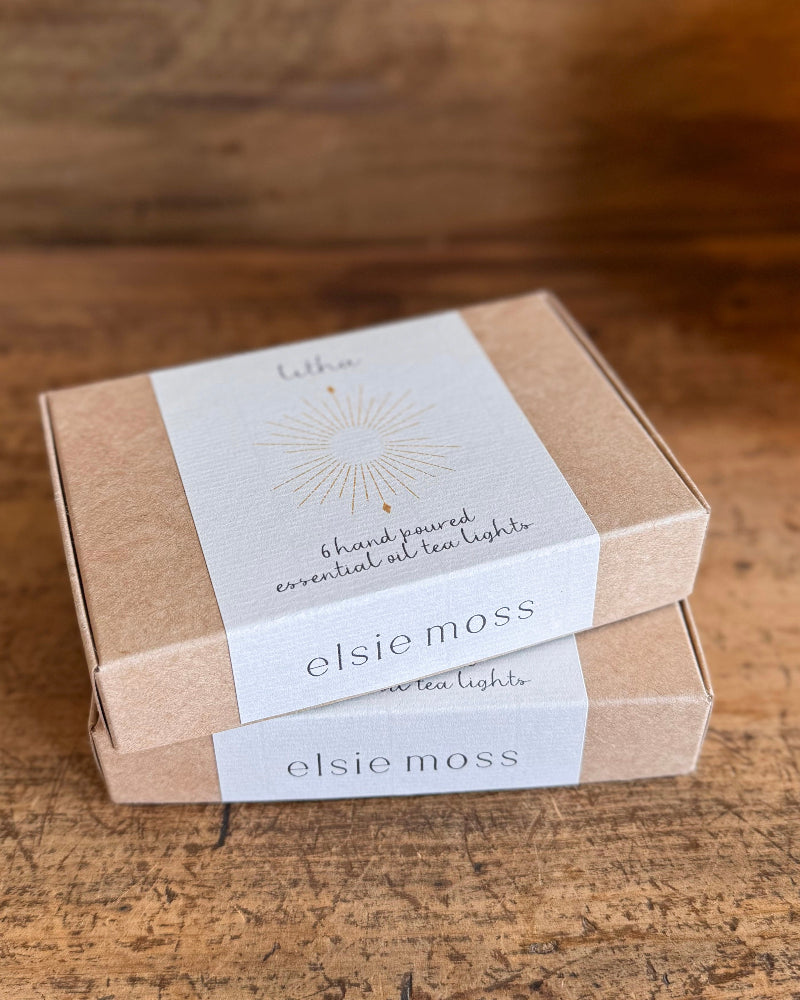 two boxes of tea lights stacked on top of each other