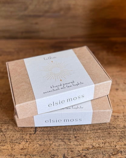 two boxes of tea lights stacked on top of each other
