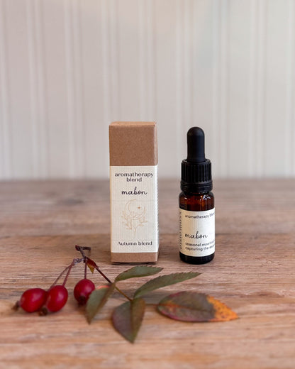 A small amber glass dropper bottle and its kraft paper box labeled &