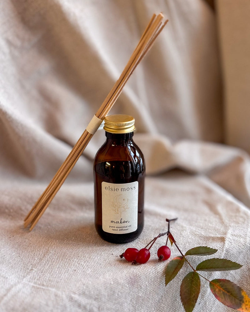 An amber glass bottle with a gold cap and a cream label reading &