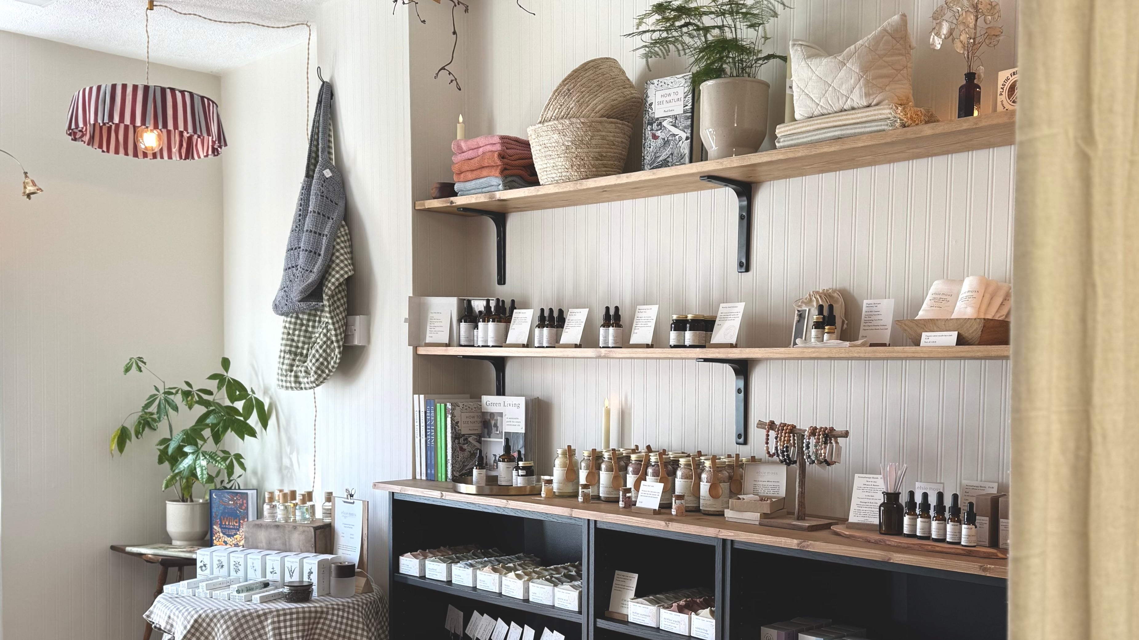 shop interior with shelving displaying face oils and body products